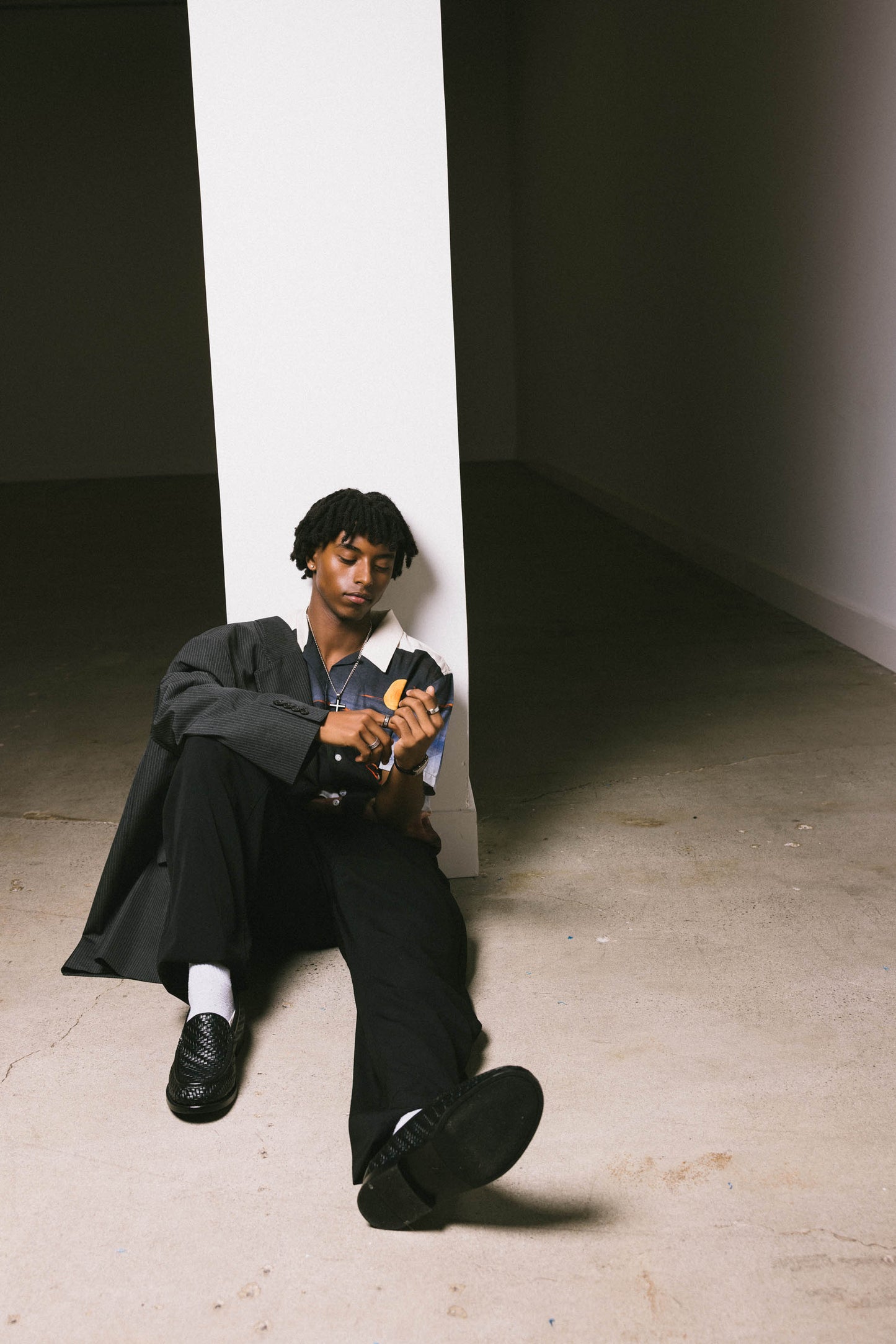 Mekonnen Knife sitting against a wall in a minimalistic setting